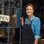 bigstock Portrait of a happy waitress s 270854422