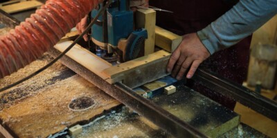 Focused,Woodworking,On,A,Machine.,This,Scene,Captures,The,Balance