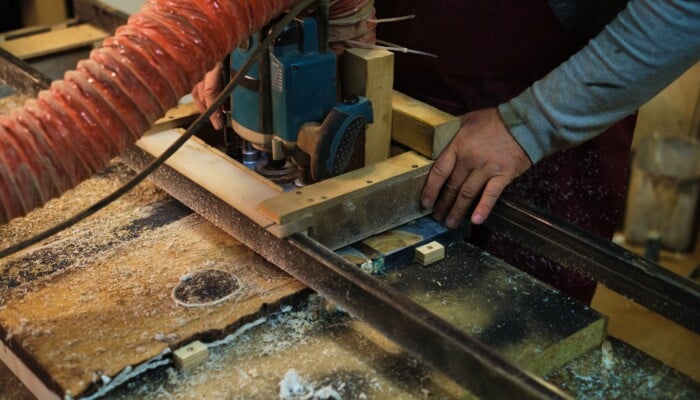 Focused,Woodworking,On,A,Machine.,This,Scene,Captures,The,Balance